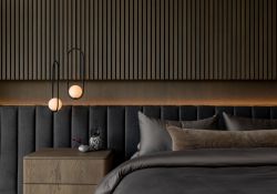 Luxury bedroom featuring custom backdrop of oak millwork, integrated upholseterd headboard.  Sumptious Sateen sheets and accent pillows from Restoration Hardware