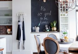 open concept kitchen & dining with chalkboard inset & custom cabinetry