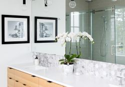 bathroom vanity design with double sinks and hanging lights