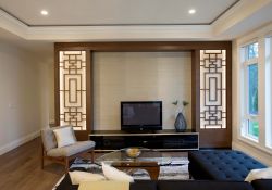 living room with intricate design features on entertainment wall surround